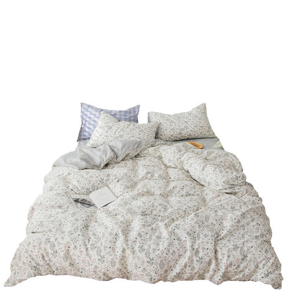 Petite parure de lit quatre pièces en pur coton uni et rustique à motif floral