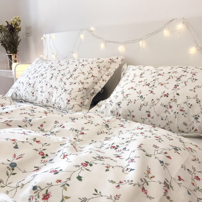 Ensemble de quatre pièces de petit lit en coton fleuri