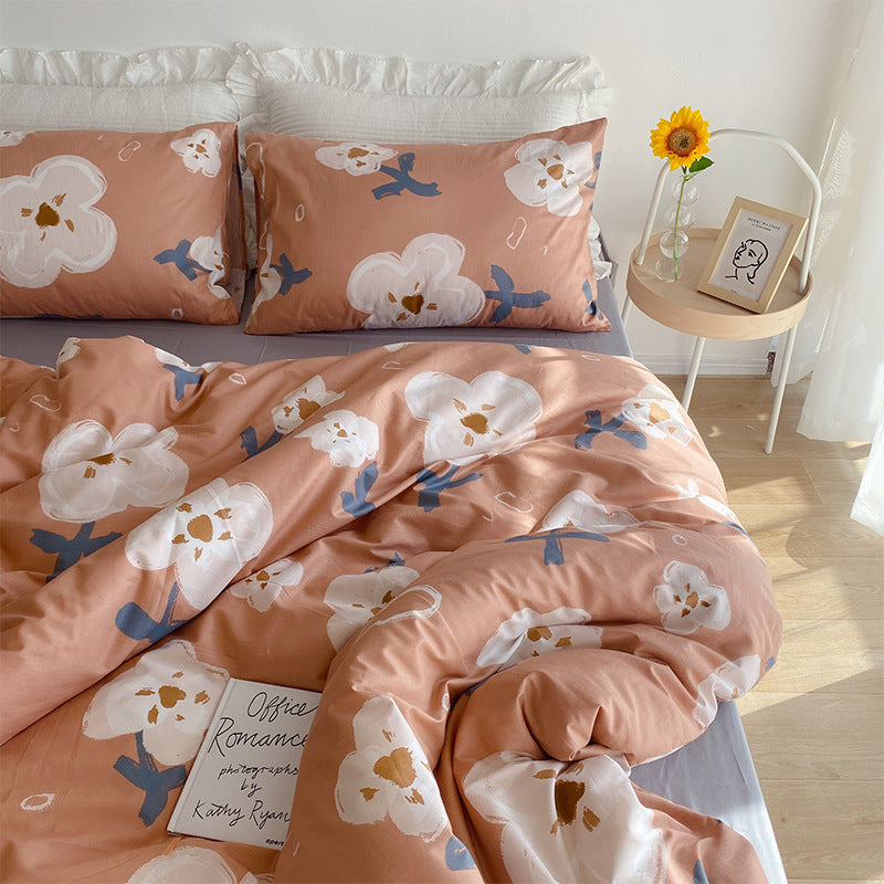 Juego de cama de cuatro piezas con diseño de corazón y flores pequeñas para niña