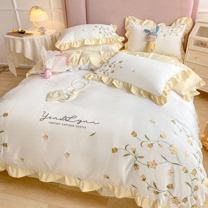 Housse de couette brodée en quatre pièces pour lit en coton lavé