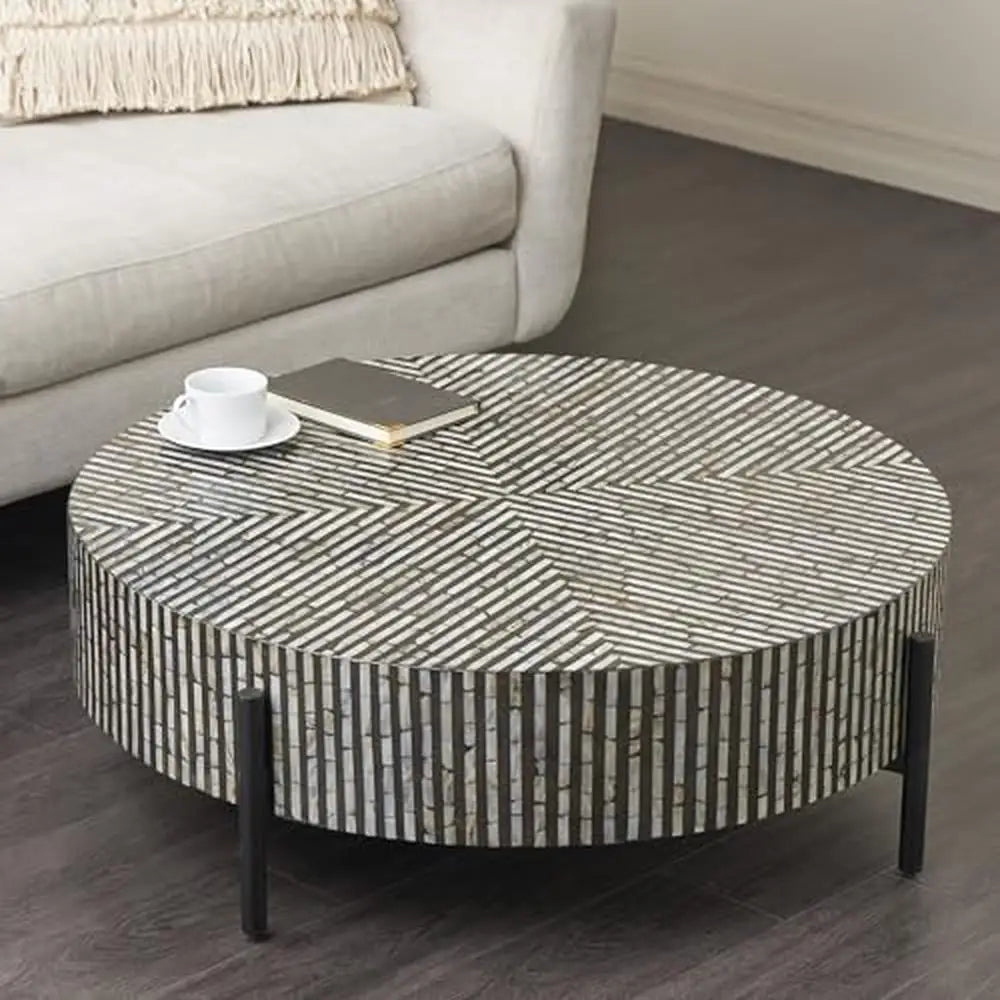 Table basse ronde moderne en nacre géométrique avec pieds gris et noirs pour salon