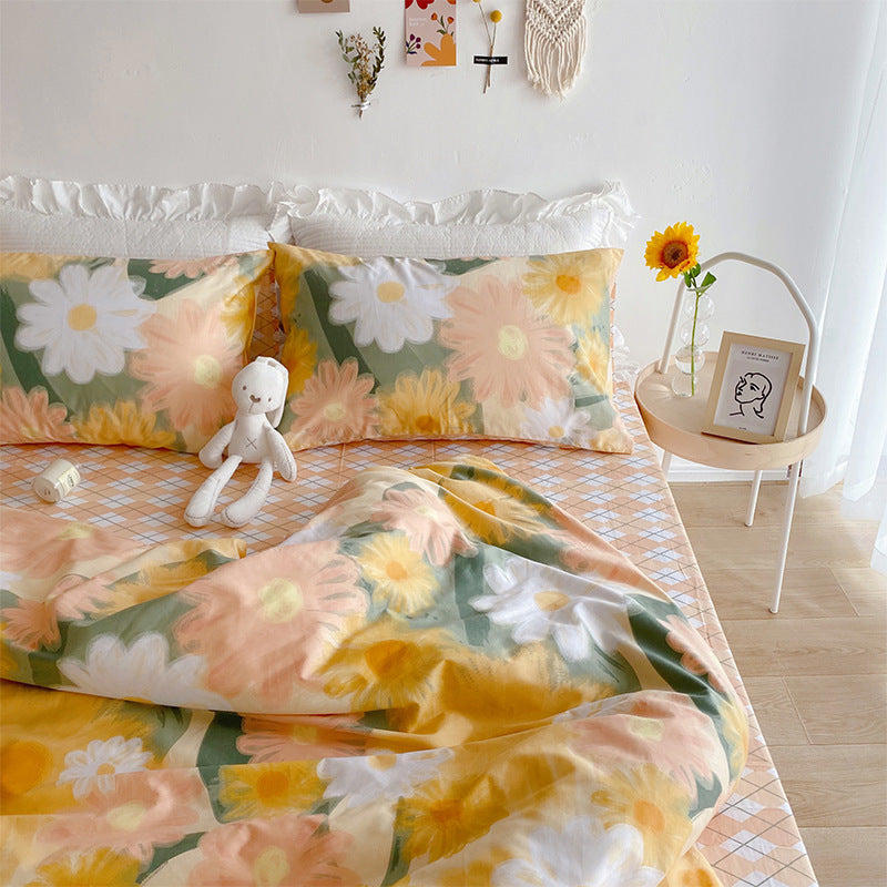 Juego de cama de cuatro piezas con diseño de corazón y flores pequeñas para niña