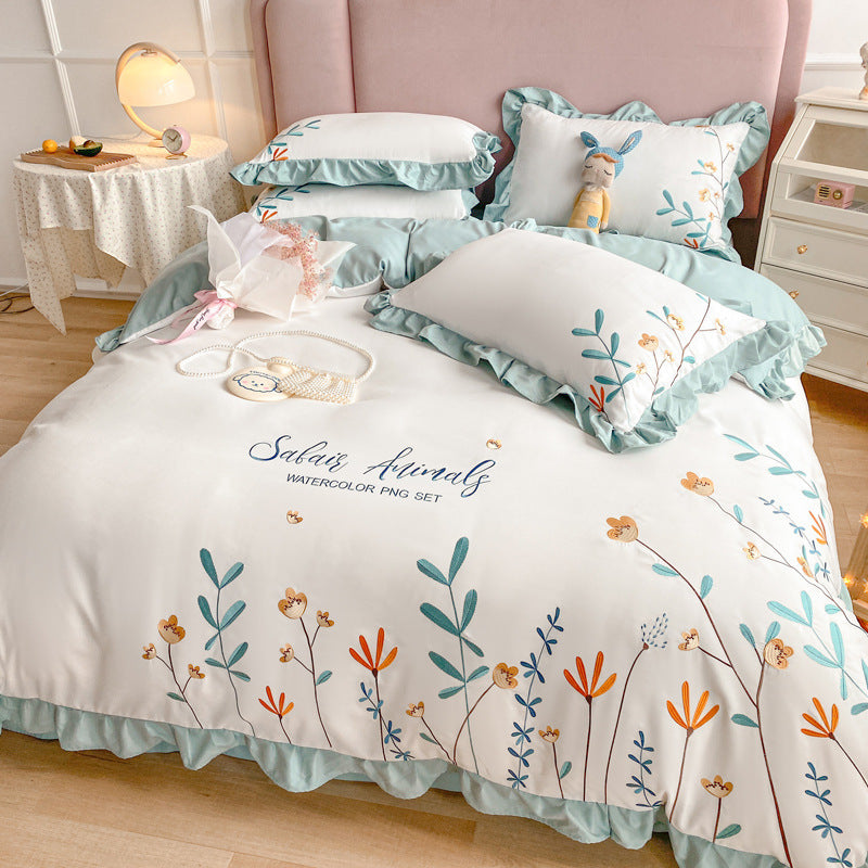 Housse de couette brodée en quatre pièces pour lit en coton lavé