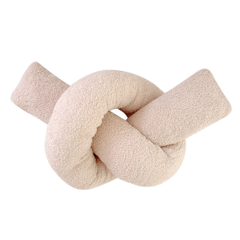 Coussin en peluche à forme géométrique avec boule et corde nouée